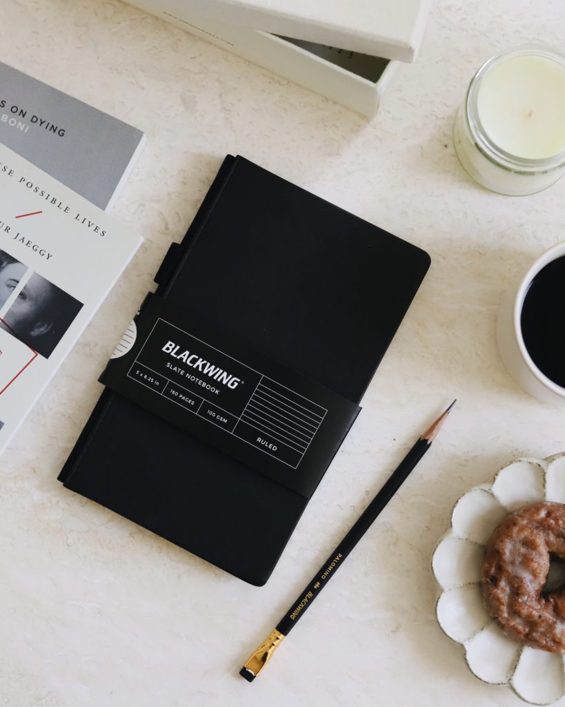 A Blackwing Slate Notebook with a pencil 