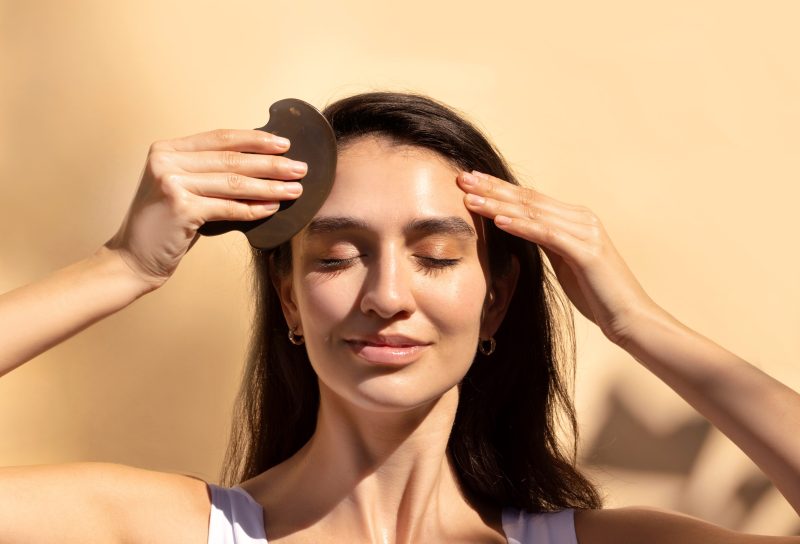 YINA Bian Stone Gua Sha for lifted face and smooth forehead fine lines and wrinkles.